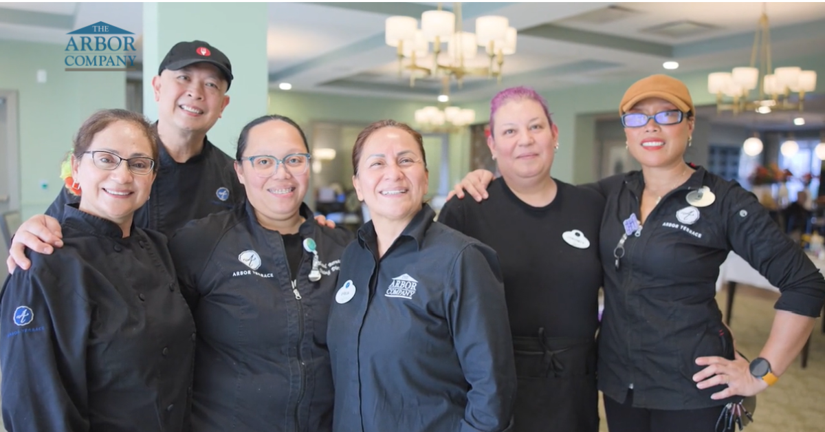 Arbor Terrace Naperville - A group of dining staff smiling for the camera (1)