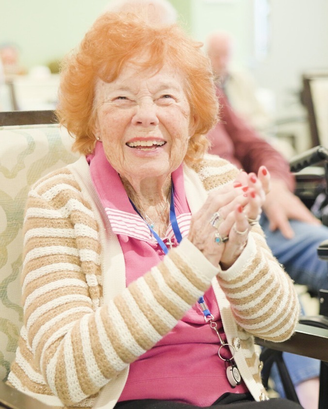 A senior lady clapping her hands