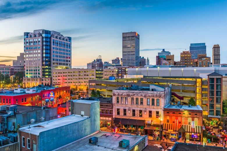 The colorful Midtown Memphis skyline at dusk, home to Overton Square and Overton Park, just minutes from Opus East Memphis senior living in East Memphis, TN.