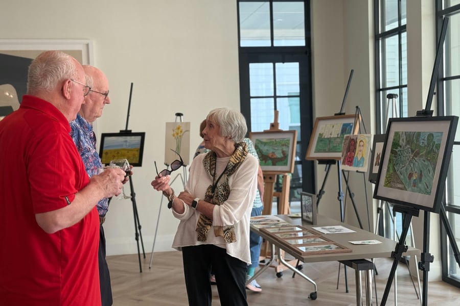 Residents chatting at an art show social