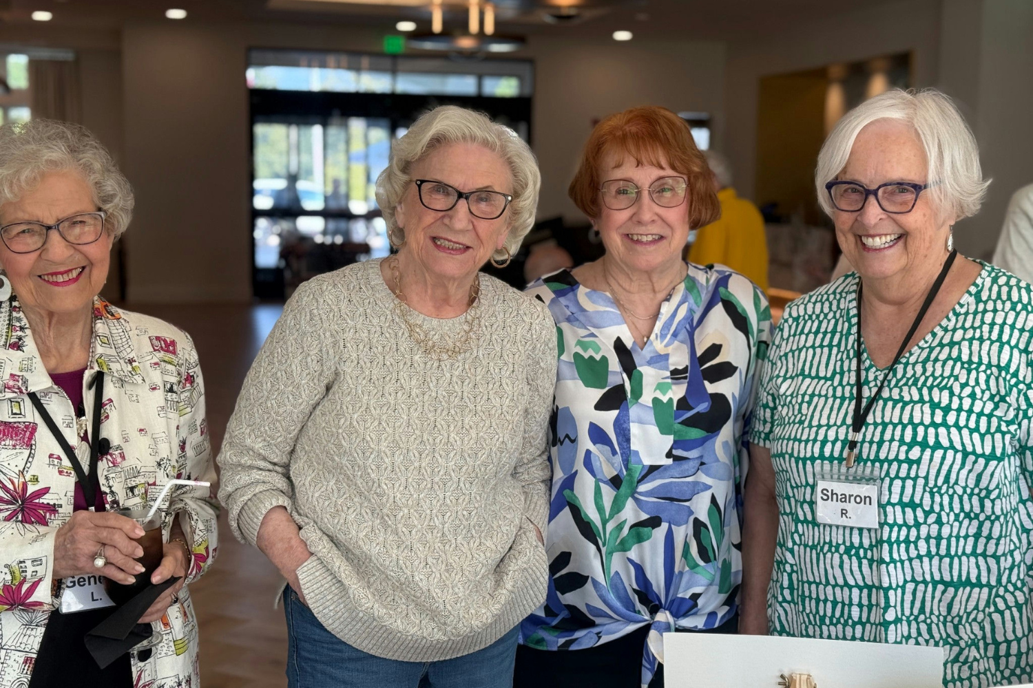 4 female residents at Opus East Memphis smiling together