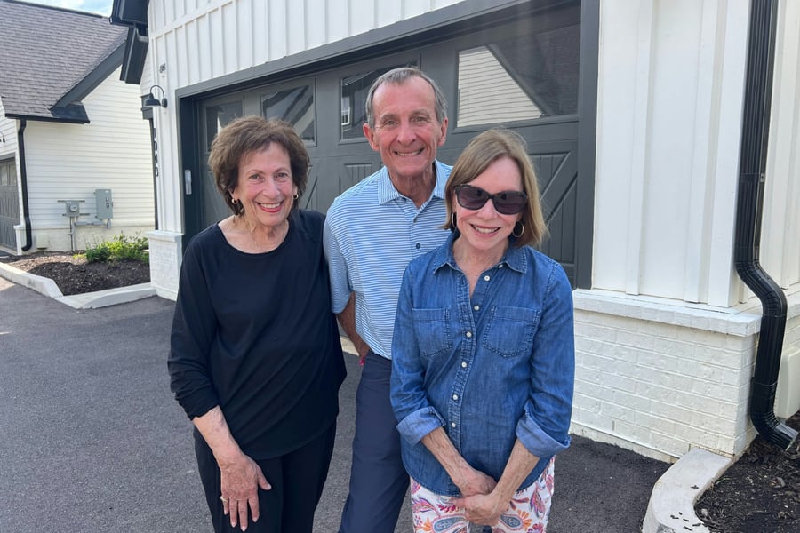 three senior residents smiling 