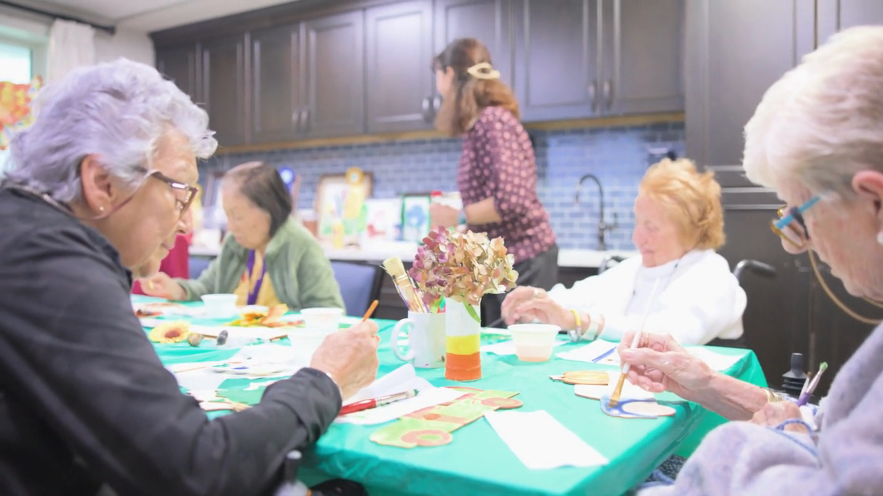 A group of senior ladies doing arts and crafts together