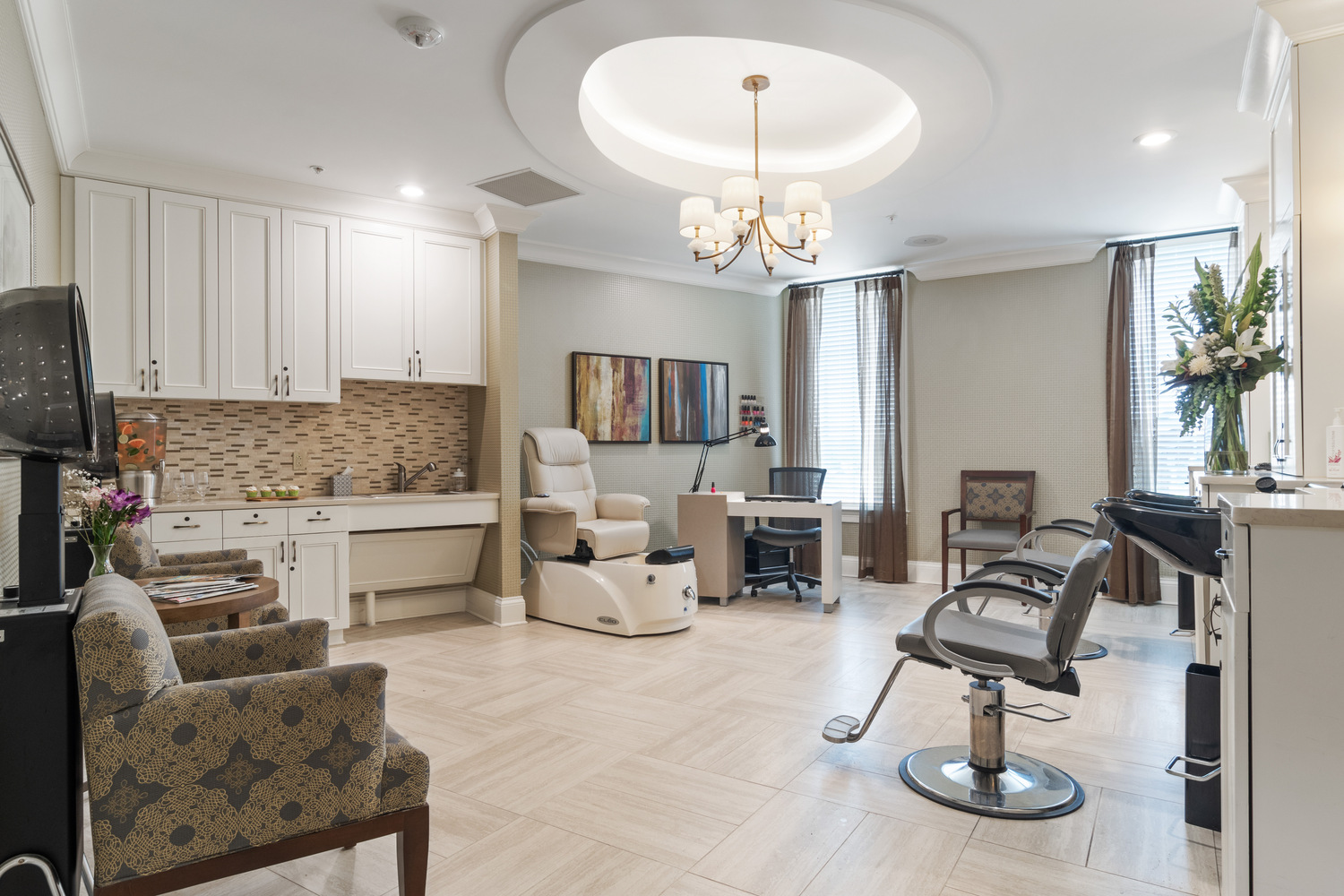A well-appointed salon space with a styling chair and soft overhead lighting at this full-service senior living community in Suwanee, GA.