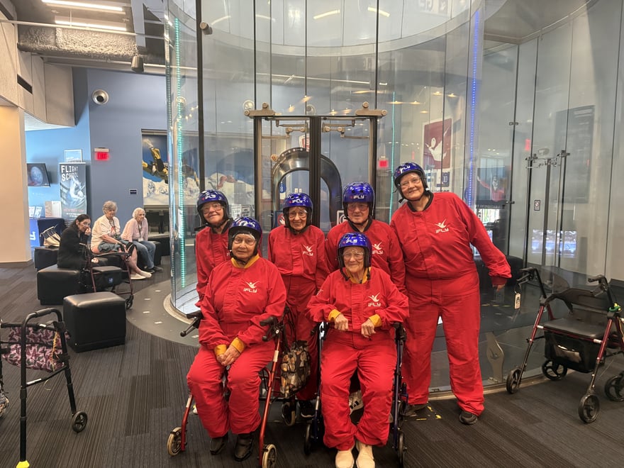 arbor-terrace-sudley-manor-seniors-group-photo-at-indoor-skydiving-tunnel