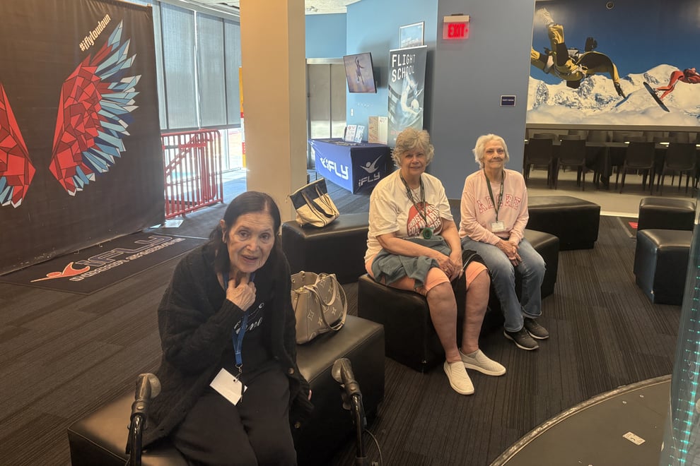 arbor-terrace-sudley-manor-seniors-relaxing-in-indoor-skydiving-lobby