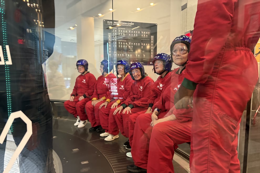 arbor-terrace-sudley-manor-seniors-seated-in-indoor-skydiving-wind-tunnel