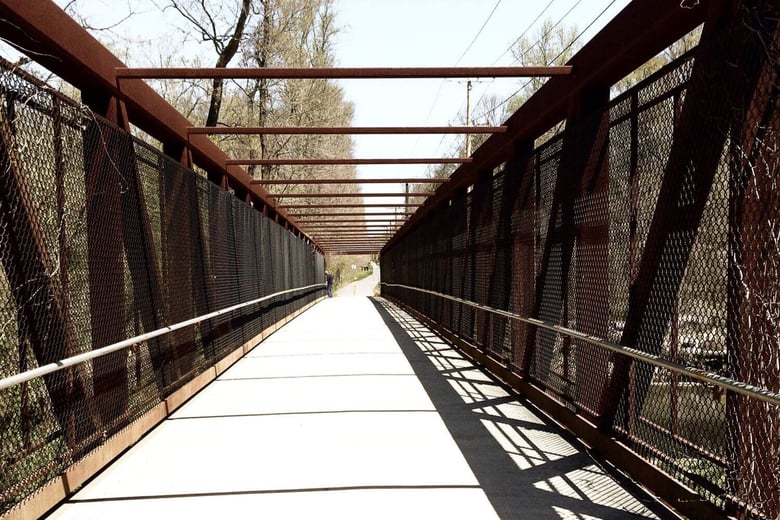 A covered pedestrian bridge in Odenton, a connected and convenient community near senior living in Gambrills, MD.