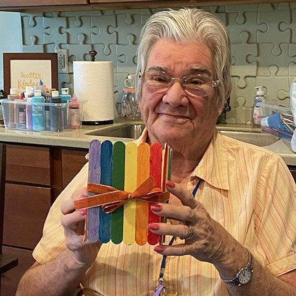 Willistown_Resident showing her rainbow-colored popsicle vase