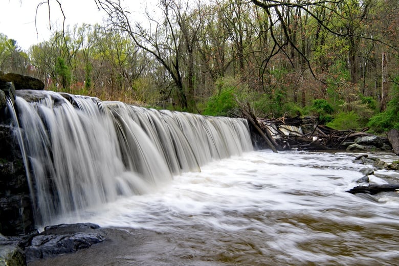 A scenic waterfall cascading over rocks near Media, PA, a historic borough close to Arbor Terrace Willistown assisted living West Chester PA.