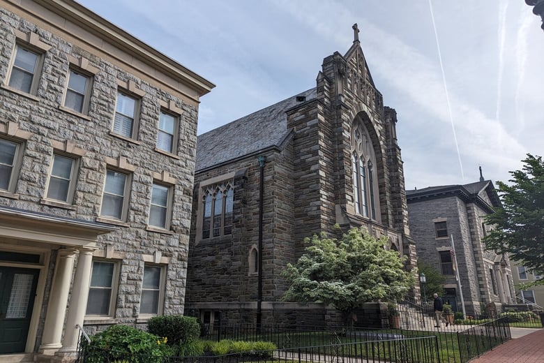 A stately stone church and building in downtown West Chester PA, the historic county seat near Arbor Terrace Willistown senior living West Chester Pennsylvania.