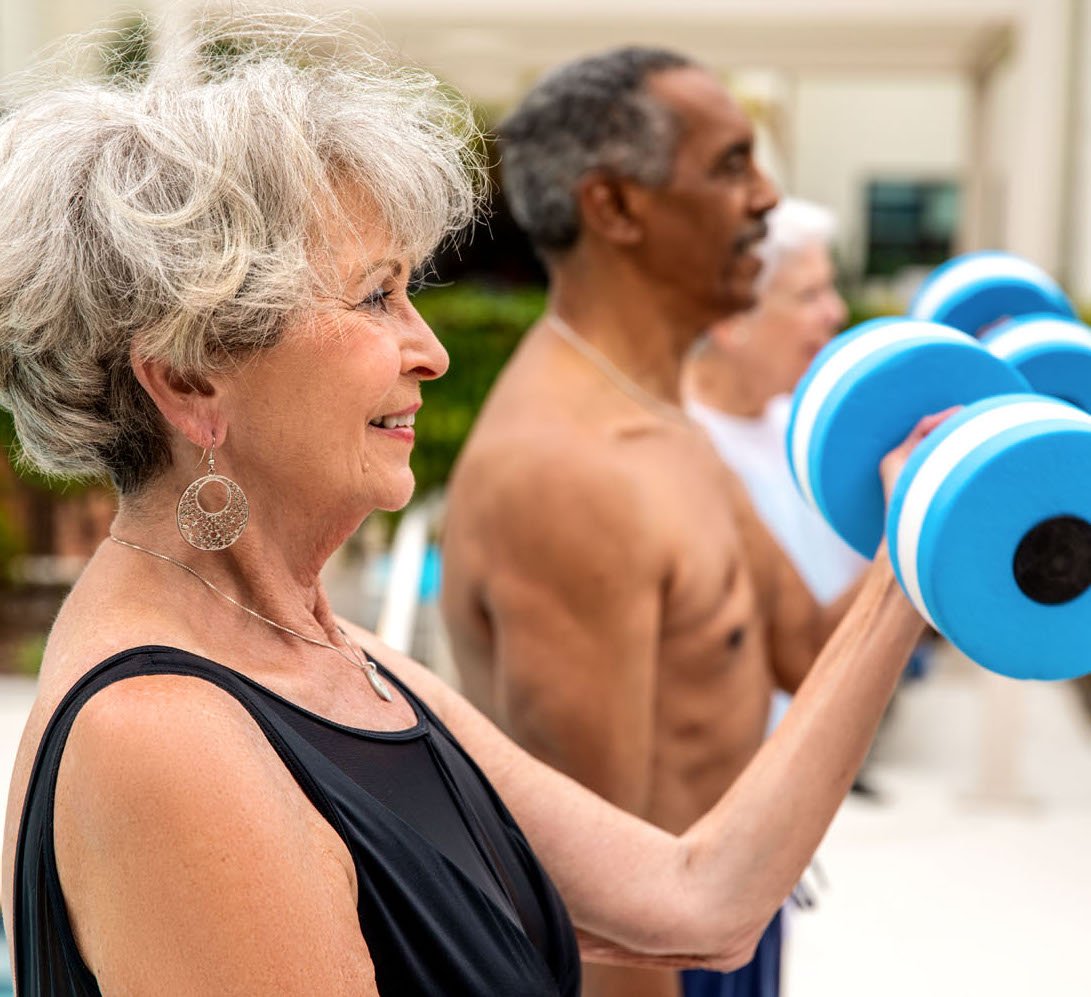 Residents lifting weights poolside