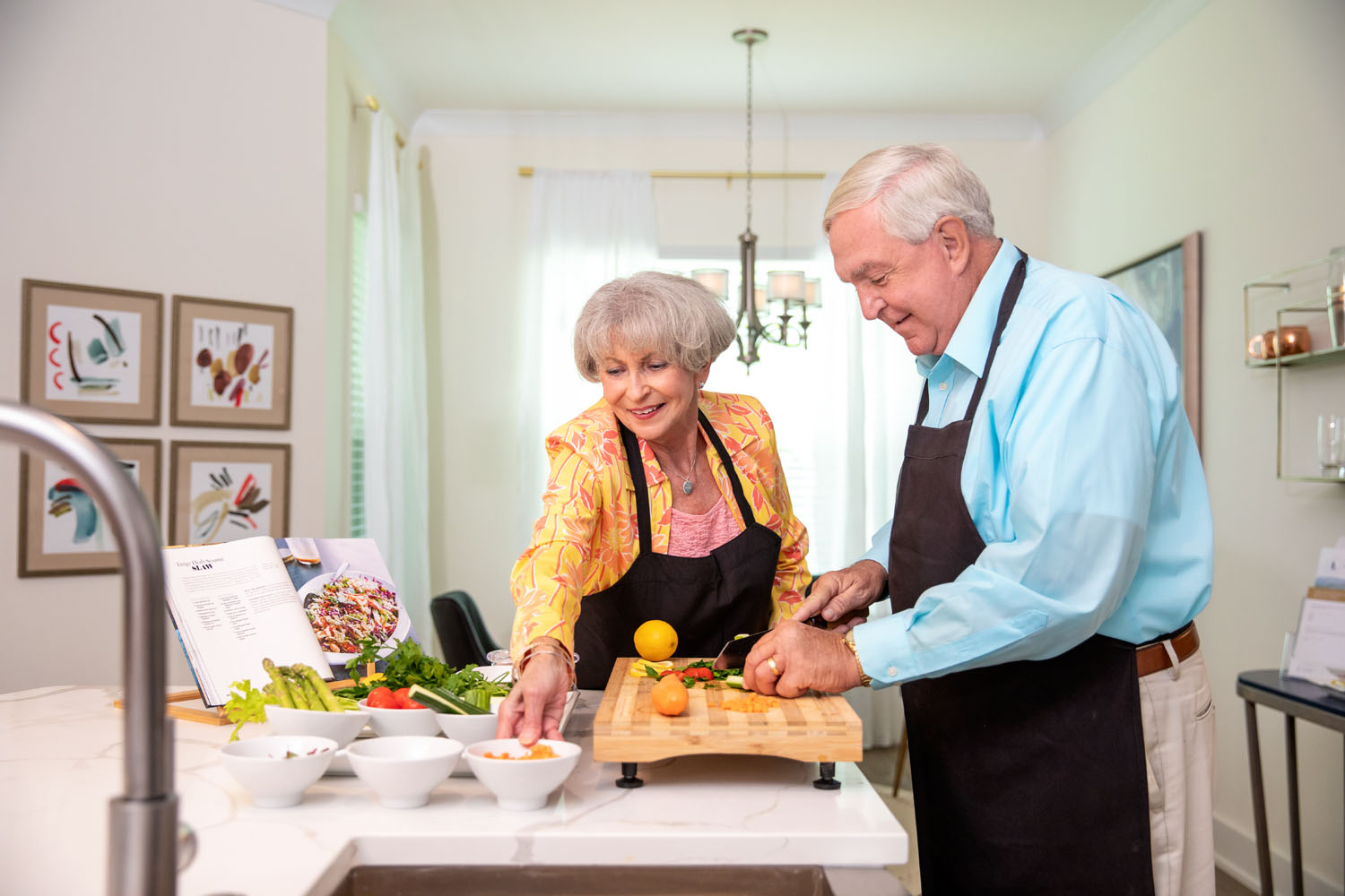 Resident couple prepping for dinner with various vegetables
