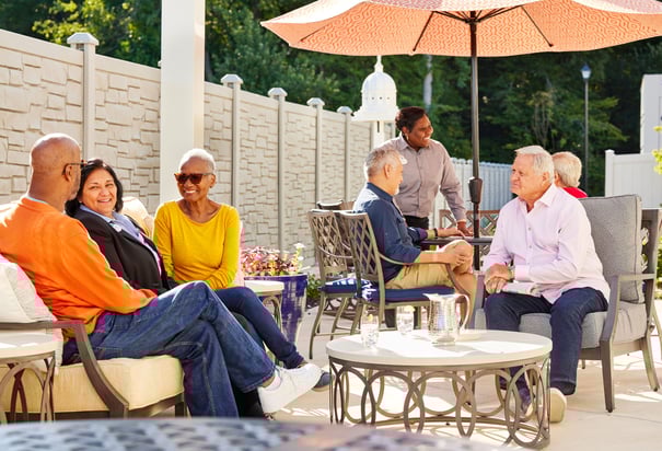 Opus East Memphis residents sitting outside in the patio area