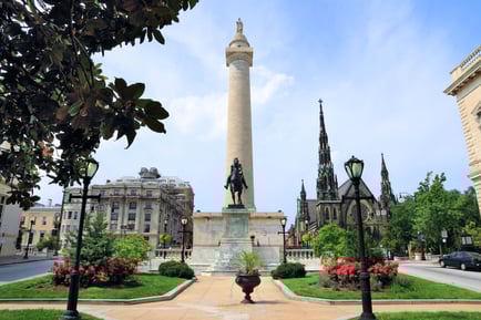 A scenic view of a historic monument and city landmark surrounded by lush greenery and flowers, near our senior living community serving the Gambrills, MD area.
