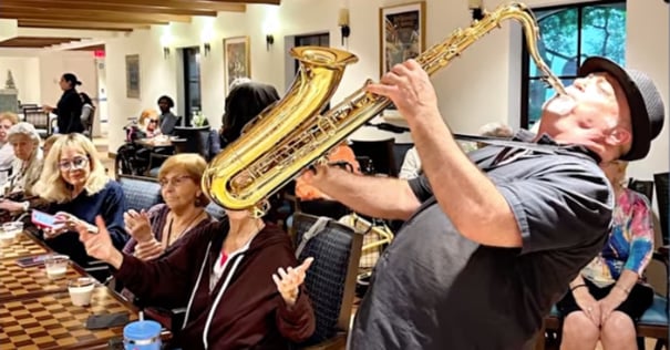Man playing the trumpet during happy hour