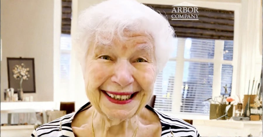 female resident of Arbor Terrace Norwood smiling