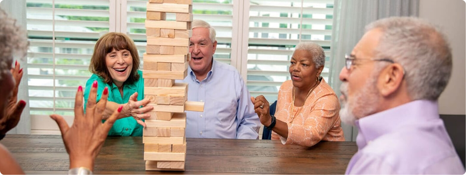 Residents playing jenga hoping that the blocks don't fall down