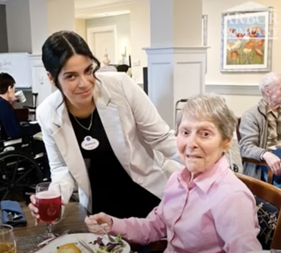 Staff member and resident dining