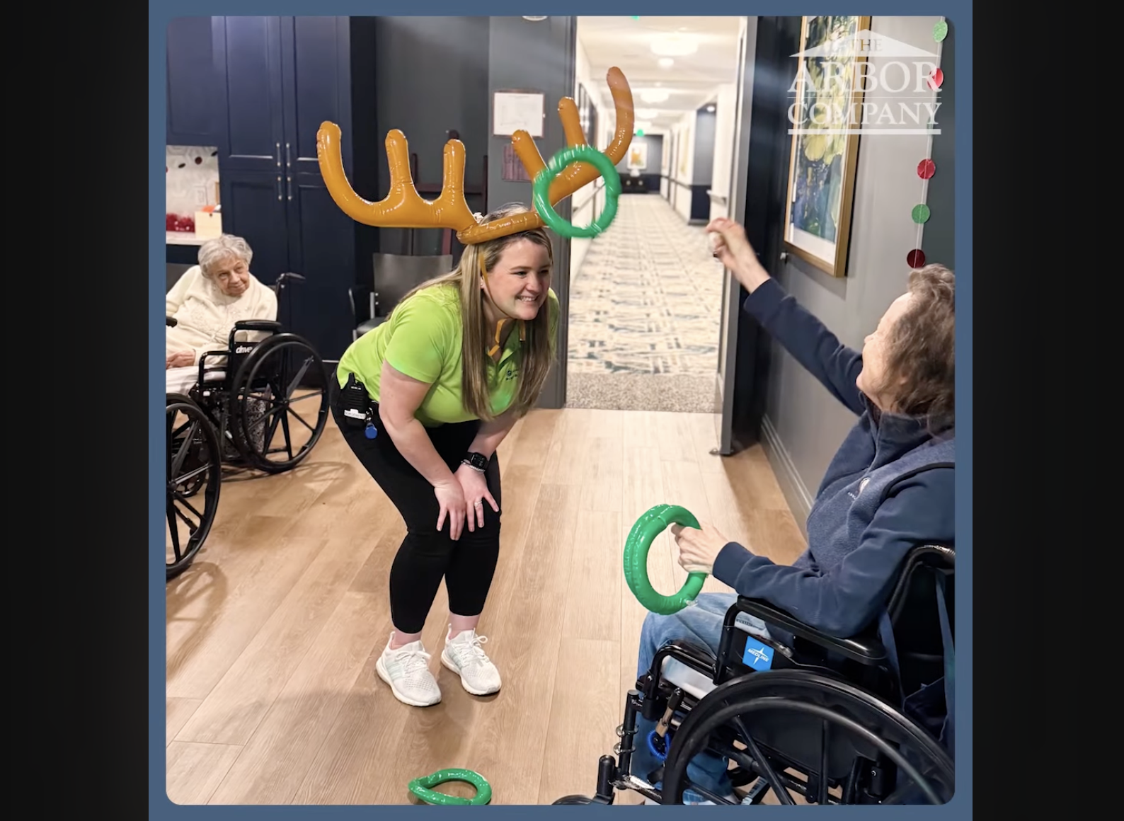 Resident and staff member engaging in a holiday activity