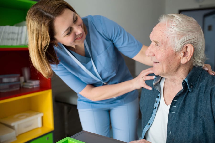 Caregiver assisting resident