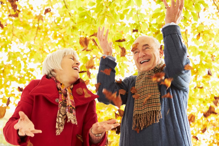 Basking Ridge male and female residents playing in leaves 
