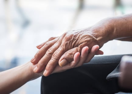 a hand reaching out to another hand
