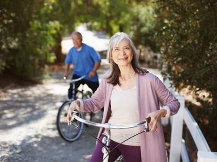 Senior by a bike