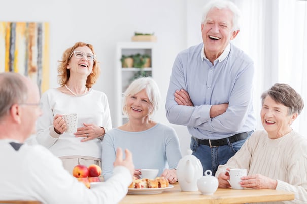 a group of seniors enjoying tea