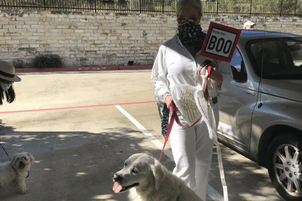 A person in white holds a 