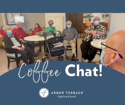 Residents gather for a lively coffee chat in the common area at Arbor Terrace Highland Park, embracing the active senior lifestyle in Highland Park, IL. Social connection is central to senior living on the North Shore.