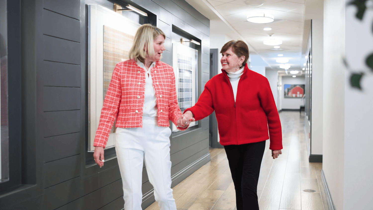 Basking Ridge staff and resident walking in the halls 