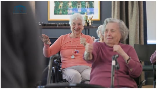 Happy resident ladies dancing