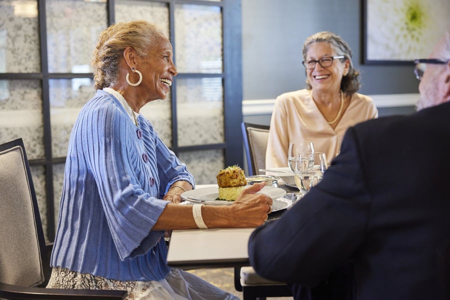 senior dining with friends