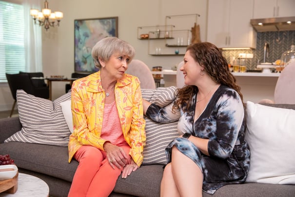senior talking with staff member