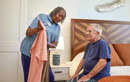 senior picking out clothes with staff