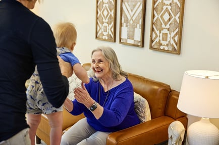Arbor Terrace Hamilton Mill Senior holding baby