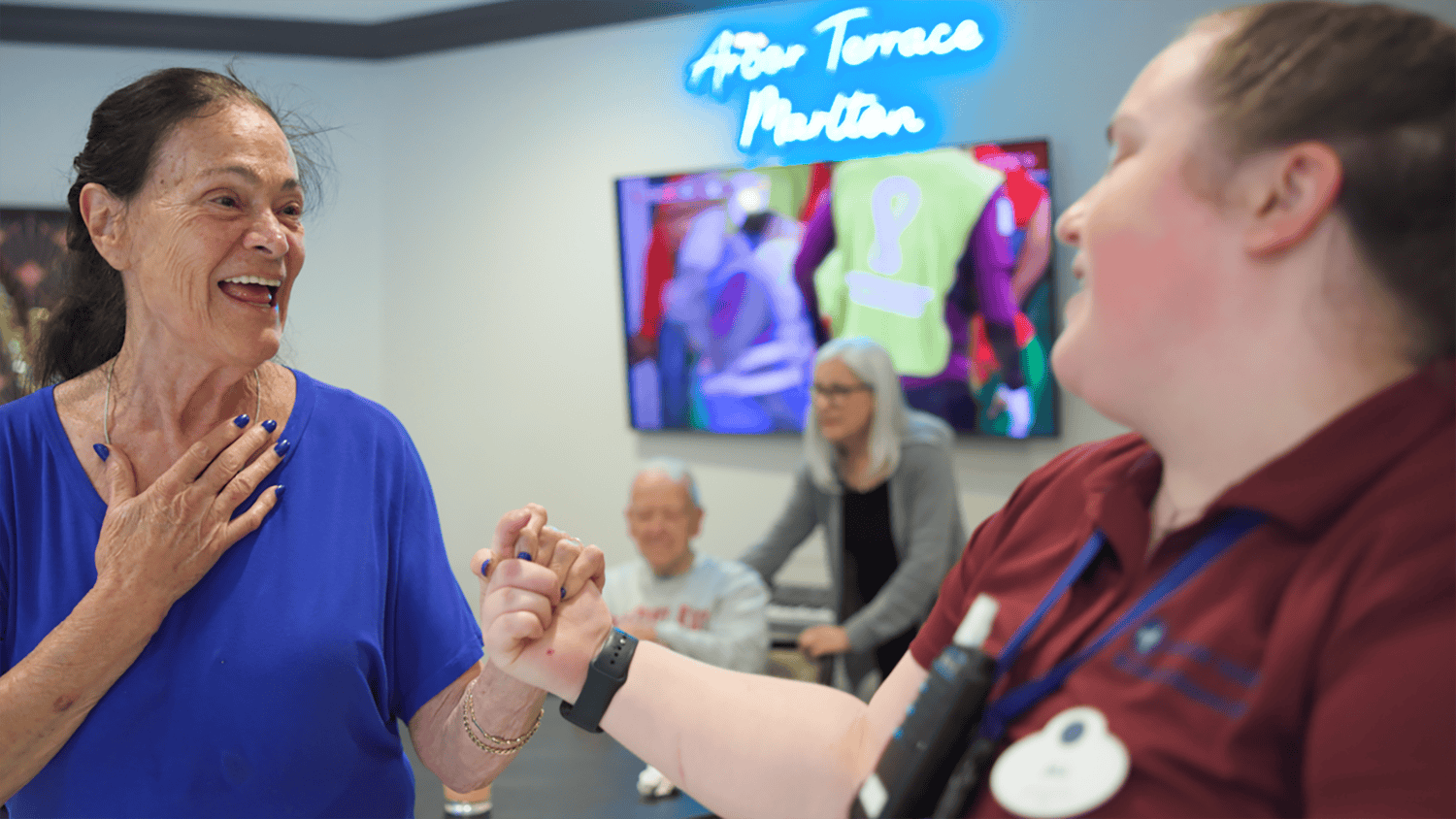 Arbor Terrace Marlton resident and staff member dancing 
