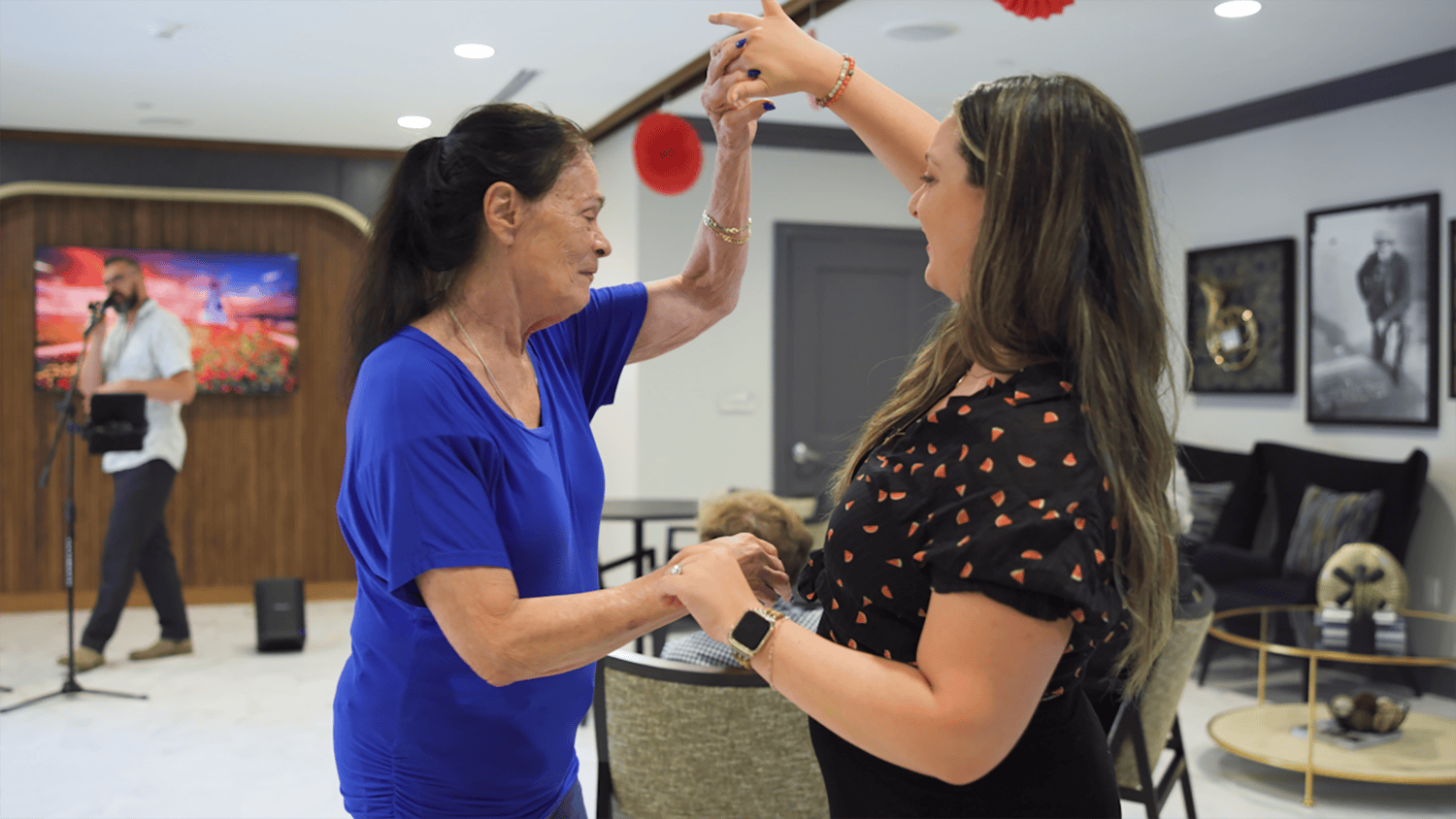 Arbor Terrace Marlton resident and staff member dancing 
