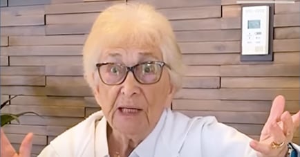 A resident speaks expressively in her living space at Arbor Terrace Morris Plains, reflecting the personalized assisted living care and vibrant, engaged senior lifestyle found in Morris Plains, NJ.