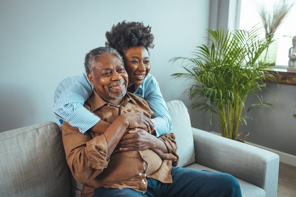 Residents Embracing On a Couch