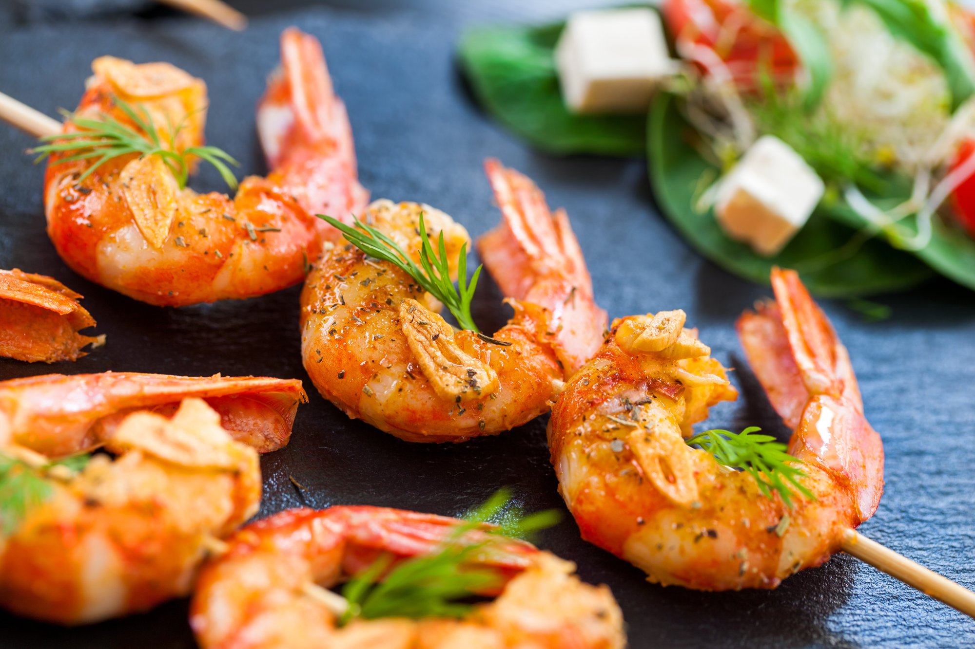 A platter of grilled shrimp skewers served fresh, showcasing the vibrant local dining options available to residents of Barrington Terrace, an assisted living community in Fort Myers, FL.