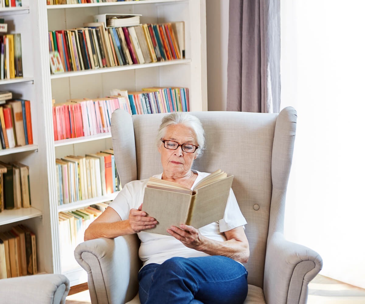 Woman reading in library room