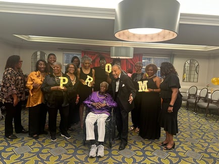 a group of senior residents celebrating their senior living community's prom 