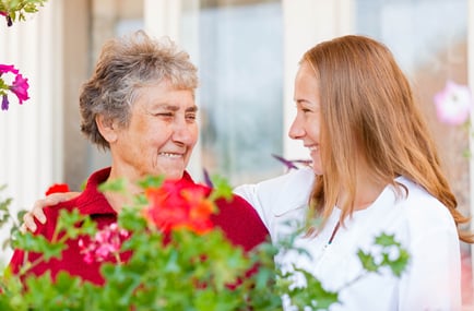 A senior lady smiling with loved one