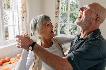 Senior couple smiling and dancing