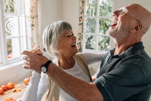 Senior couple smiling and dancing