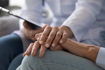 A close-up of caring hands gently resting together, reflecting the compassionate dementia care and personalized support offered in Suwanee, GA.