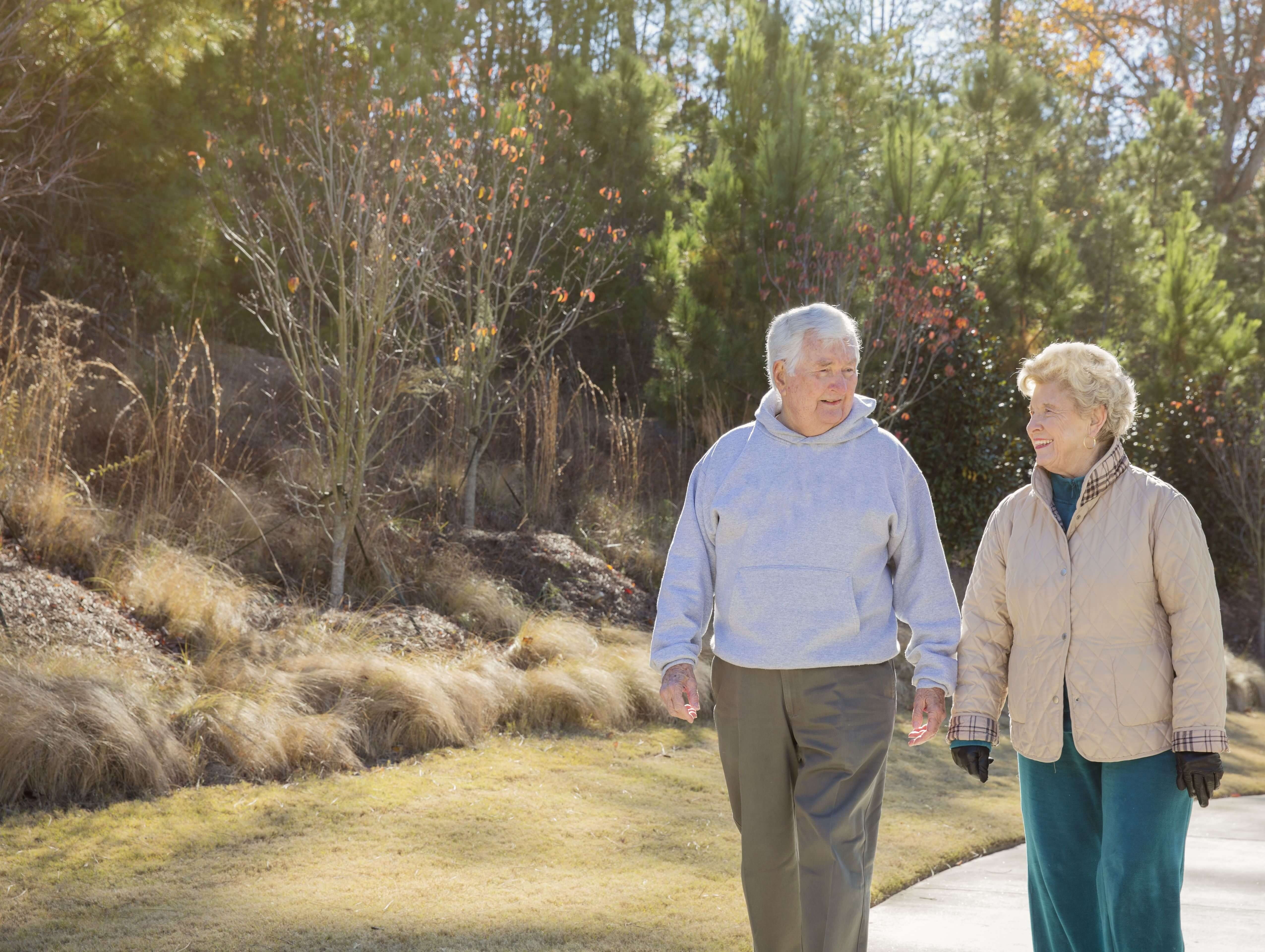 Senior couple taking a walk on outdoor path
