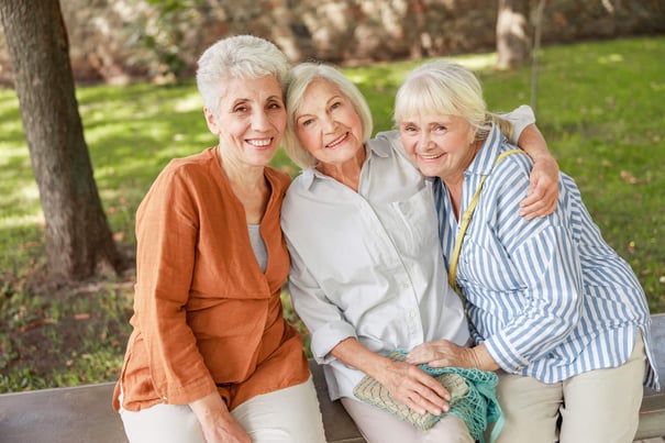 3 elderly women hugging